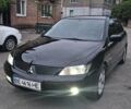 Черный Мицубиси Лансер, объемом двигателя 1.6 л и пробегом 350 тыс. км за 4750 $, фото 1 на Automoto.ua