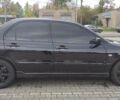 Черный Мицубиси Лансер, объемом двигателя 2 л и пробегом 181 тыс. км за 5500 $, фото 4 на Automoto.ua