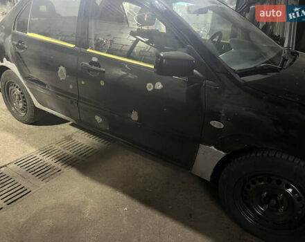 Черный Мицубиси Лансер, объемом двигателя 1.58 л и пробегом 250 тыс. км за 2450 $, фото 7 на Automoto.ua