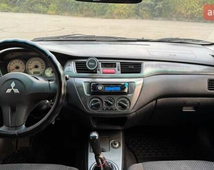 Черный Мицубиси Лансер, объемом двигателя 1.59 л и пробегом 221 тыс. км за 4200 $, фото 8 на Automoto.ua
