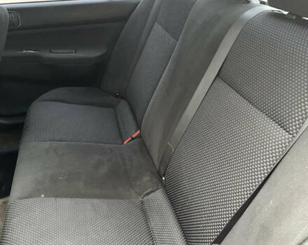 Чорний Міцубісі Lancer, об'ємом двигуна 1.58 л та пробігом 237 тис. км за 3500 $, фото 4 на Automoto.ua