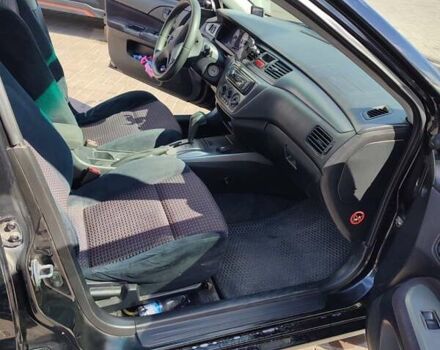 Черный Мицубиси Лансер, объемом двигателя 1.58 л и пробегом 128 тыс. км за 4600 $, фото 15 на Automoto.ua