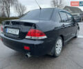 Чорний Міцубісі Lancer, об'ємом двигуна 1.58 л та пробігом 196 тис. км за 3800 $, фото 9 на Automoto.ua