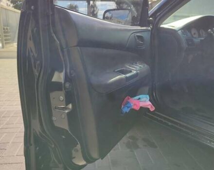 Черный Мицубиси Лансер, объемом двигателя 1.58 л и пробегом 128 тыс. км за 4600 $, фото 35 на Automoto.ua