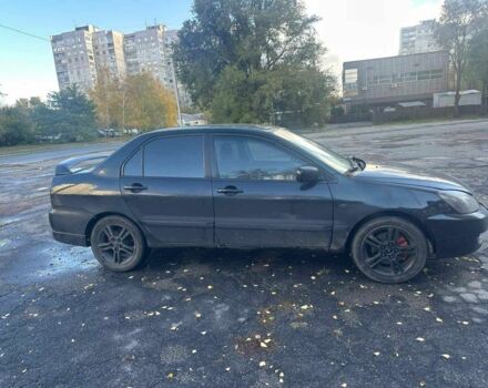 Черный Мицубиси Лансер, объемом двигателя 2 л и пробегом 200 тыс. км за 2999 $, фото 2 на Automoto.ua