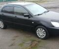 Чорний Міцубісі Lancer, об'ємом двигуна 1.6 л та пробігом 230 тис. км за 3250 $, фото 1 на Automoto.ua