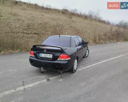 Чорний Міцубісі Lancer, об'ємом двигуна 1.6 л та пробігом 245 тис. км за 4000 $, фото 2 на Automoto.ua