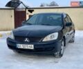 Чорний Міцубісі Lancer, об'ємом двигуна 1.58 л та пробігом 237 тис. км за 3850 $, фото 1 на Automoto.ua