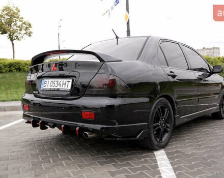 Черный Мицубиси Лансер, объемом двигателя 2 л и пробегом 253 тыс. км за 6900 $, фото 3 на Automoto.ua