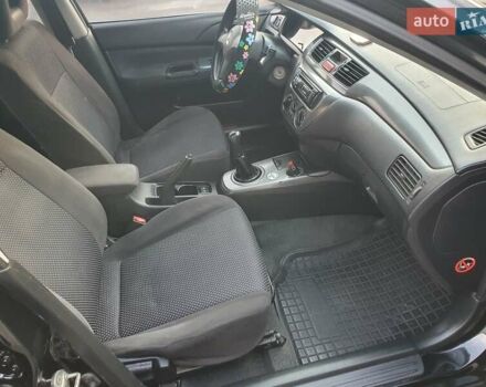 Черный Мицубиси Лансер, объемом двигателя 1.58 л и пробегом 222 тыс. км за 2999 $, фото 17 на Automoto.ua