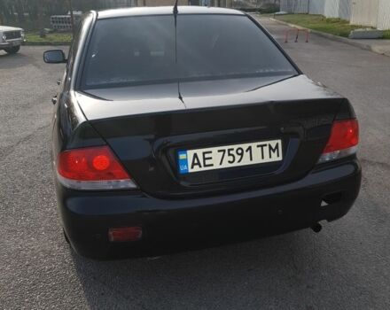 Черный Мицубиси Лансер, объемом двигателя 1.6 л и пробегом 290 тыс. км за 3200 $, фото 3 на Automoto.ua