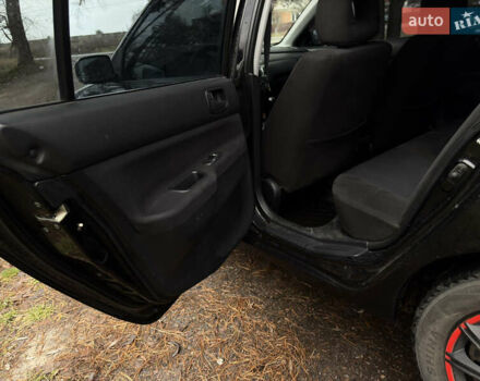 Чорний Міцубісі Lancer, об'ємом двигуна 1.58 л та пробігом 210 тис. км за 3900 $, фото 13 на Automoto.ua