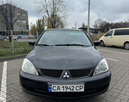 Черный Мицубиси Лансер, объемом двигателя 1.58 л и пробегом 370 тыс. км за 3500 $, фото 1 на Automoto.ua