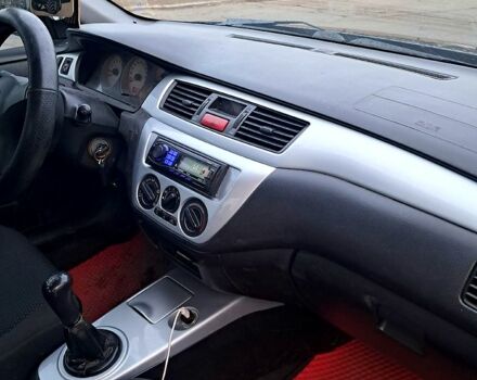 Чорний Міцубісі Lancer, об'ємом двигуна 1.6 л та пробігом 297 тис. км за 2100 $, фото 7 на Automoto.ua