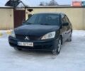 Чорний Міцубісі Lancer, об'ємом двигуна 1.58 л та пробігом 237 тис. км за 3850 $, фото 3 на Automoto.ua