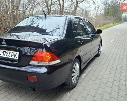 Черный Мицубиси Лансер, объемом двигателя 1.58 л и пробегом 246 тыс. км за 4200 $, фото 4 на Automoto.ua