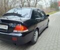 Черный Мицубиси Лансер, объемом двигателя 1.58 л и пробегом 246 тыс. км за 4200 $, фото 4 на Automoto.ua