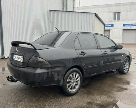 Черный Мицубиси Лансер, объемом двигателя 1.6 л и пробегом 368 тыс. км за 3200 $, фото 3 на Automoto.ua