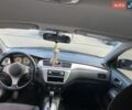 Черный Мицубиси Лансер, объемом двигателя 2 л и пробегом 208 тыс. км за 4500 $, фото 5 на Automoto.ua