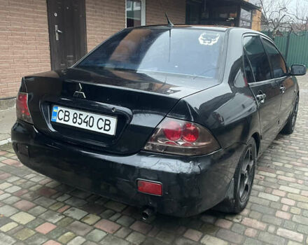 Чорний Міцубісі Lancer, об'ємом двигуна 1.59 л та пробігом 305 тис. км за 2950 $, фото 15 на Automoto.ua
