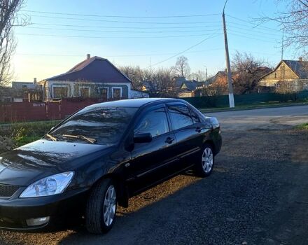 Чорний Міцубісі Lancer, об'ємом двигуна 1.6 л та пробігом 330 тис. км за 4500 $, фото 10 на Automoto.ua