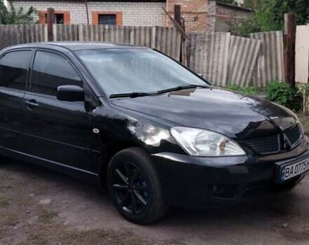 Чорний Міцубісі Lancer, об'ємом двигуна 1.59 л та пробігом 185 тис. км за 4900 $, фото 7 на Automoto.ua