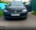 Чорний Міцубісі Lancer, об'ємом двигуна 2 л та пробігом 322 тис. км за 2000 $, фото 1 на Automoto.ua