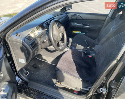 Чорний Міцубісі Lancer, об'ємом двигуна 1.58 л та пробігом 236 тис. км за 4500 $, фото 5 на Automoto.ua