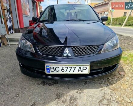 Черный Мицубиси Лансер, объемом двигателя 2 л и пробегом 168 тыс. км за 4999 $, фото 1 на Automoto.ua