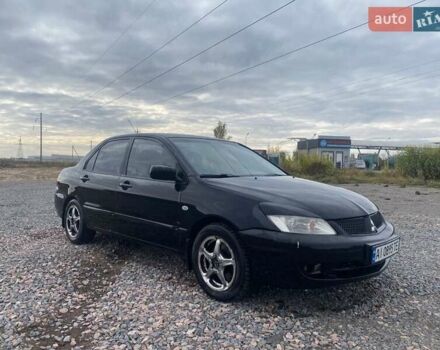 Чорний Міцубісі Lancer, об'ємом двигуна 1.6 л та пробігом 335 тис. км за 3500 $, фото 2 на Automoto.ua