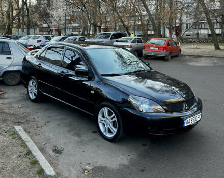 Черный Мицубиси Лансер, объемом двигателя 2 л и пробегом 255 тыс. км за 5000 $, фото 1 на Automoto.ua