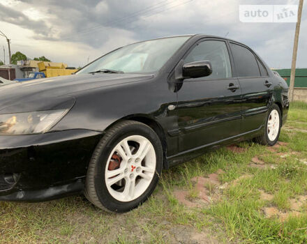 Чорний Міцубісі Lancer, об'ємом двигуна 2 л та пробігом 283 тис. км за 5000 $, фото 7 на Automoto.ua