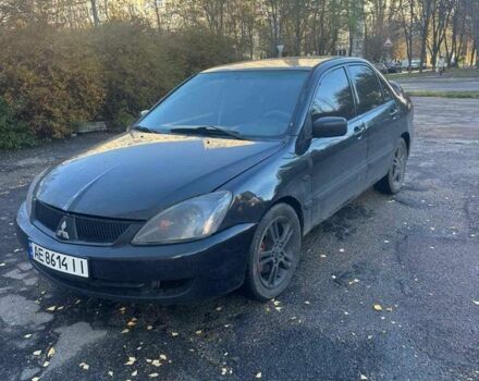 Черный Мицубиси Лансер, объемом двигателя 2 л и пробегом 200 тыс. км за 2999 $, фото 1 на Automoto.ua