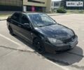 Чорний Міцубісі Lancer, об'ємом двигуна 2 л та пробігом 188 тис. км за 5999 $, фото 1 на Automoto.ua