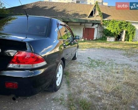 Мицубиси Лансер 2006 в Киеве на Automoto.ua Черный Мицубиси Лансер, объемом двигателя 1.58 л и пробегом 268 тыс. км за 3400 $, фото 11 на Automoto.ua