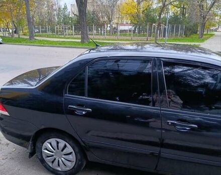 Чорний Міцубісі Lancer, об'ємом двигуна 1.6 л та пробігом 218 тис. км за 4300 $, фото 10 на Automoto.ua