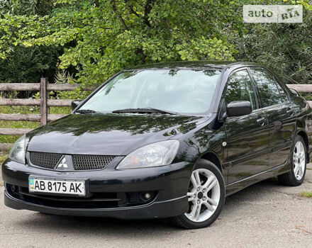 Чорний Міцубісі Lancer, об'ємом двигуна 2 л та пробігом 234 тис. км за 4999 $, фото 6 на Automoto.ua