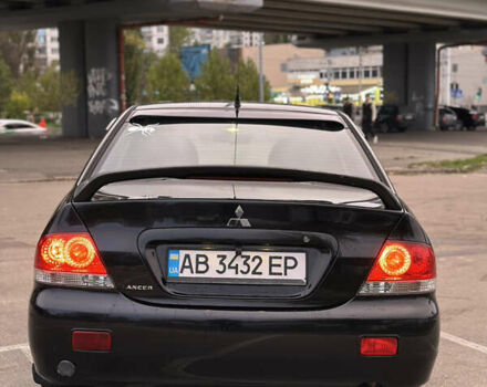 Чорний Міцубісі Lancer, об'ємом двигуна 1.58 л та пробігом 230 тис. км за 4350 $, фото 3 на Automoto.ua