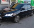 Черный Мицубиси Лансер, объемом двигателя 1.6 л и пробегом 245 тыс. км за 4100 $, фото 1 на Automoto.ua