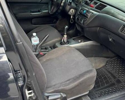 Черный Мицубиси Лансер, объемом двигателя 1.59 л и пробегом 221 тыс. км за 4200 $, фото 10 на Automoto.ua