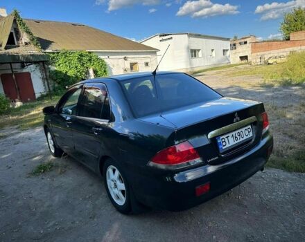 Черный Мицубиси Лансер, объемом двигателя 1.6 л и пробегом 289 тыс. км за 3200 $, фото 7 на Automoto.ua