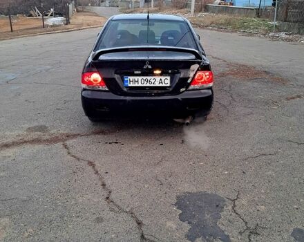 Чорний Міцубісі Lancer, об'ємом двигуна 1.6 л та пробігом 297 тис. км за 2100 $, фото 3 на Automoto.ua