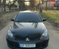 Чорний Міцубісі Lancer, об'ємом двигуна 2 л та пробігом 236 тис. км за 4799 $, фото 1 на Automoto.ua