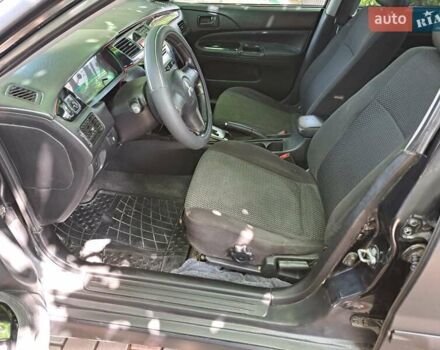 Чорний Міцубісі Lancer, об'ємом двигуна 1.58 л та пробігом 280 тис. км за 3950 $, фото 15 на Automoto.ua