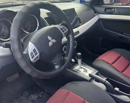 Черный Мицубиси Лансер, объемом двигателя 2 л и пробегом 208 тыс. км за 6500 $, фото 9 на Automoto.ua