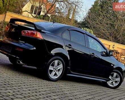 Чорний Міцубісі Lancer, об'ємом двигуна 2 л та пробігом 260 тис. км за 6555 $, фото 3 на Automoto.ua