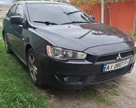 Черный Мицубиси Лансер, объемом двигателя 2 л и пробегом 277 тыс. км за 4650 $, фото 7 на Automoto.ua