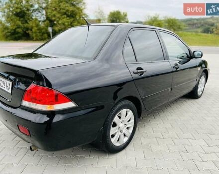 Чорний Міцубісі Lancer, об'ємом двигуна 1.6 л та пробігом 243 тис. км за 4950 $, фото 12 на Automoto.ua