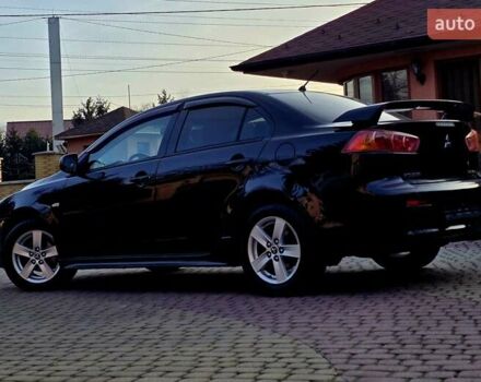 Чорний Міцубісі Lancer, об'ємом двигуна 2 л та пробігом 260 тис. км за 6555 $, фото 4 на Automoto.ua