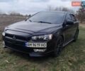Черный Мицубиси Лансер, объемом двигателя 2 л и пробегом 312 тыс. км за 6500 $, фото 1 на Automoto.ua